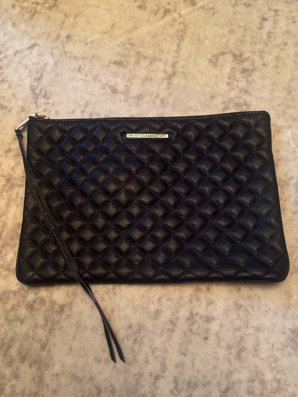 black quilted leather pouch with a gold-tone by Rebecca Minkoff